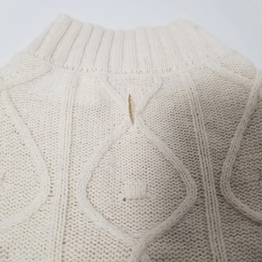 small girl doggie light sweater  one small faint stain on underside of sweater